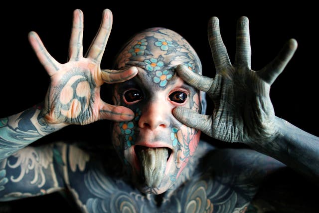 Mr Sylvain, alias Freaky Hoody, a primary school teacher and France's "most tattooed man", poses with his eyes full of black ink at Palaiseau, southern Paris, France