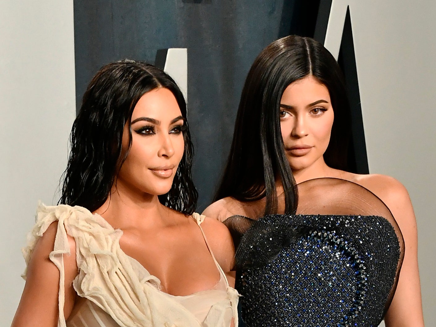 Kim Kardashian and Kylie Jenner (R) attend the 2020 Vanity Fair Oscar Party