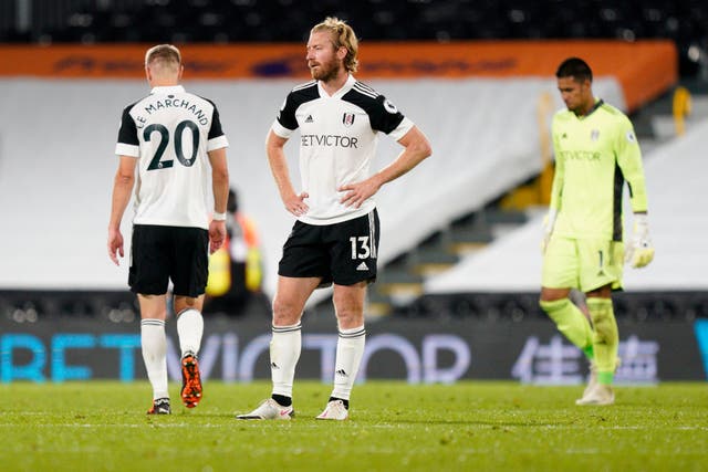 Tim Ream of Fulham looks dejected following defeat to Aston Villa