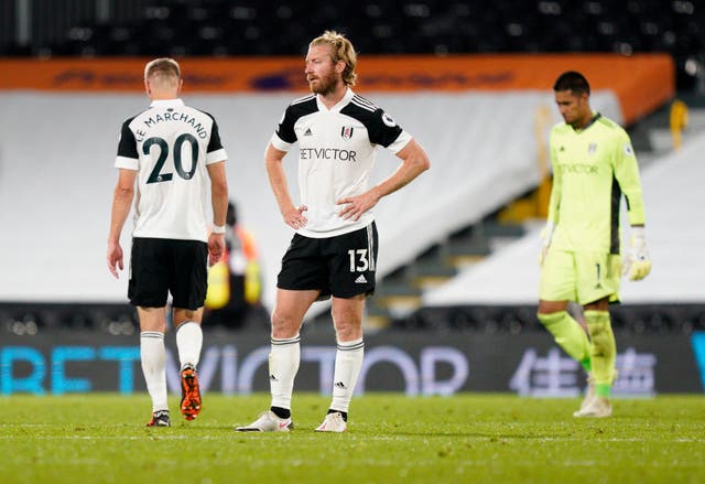 Tim Ream of Fulham looks dejected following defeat to Aston Villa