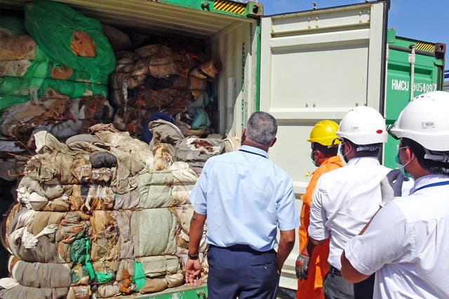 Customs officials inspect container at Colombo port in 2019 following similar incident of hazardous clinical waste entering the country