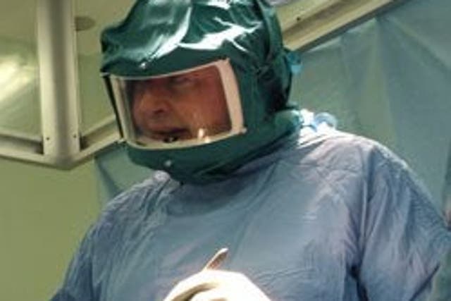 Derek McMinn carries out a procedure at Edgbaston Hospital