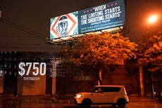 Artists set up wall of anti-Trump billboards outside debate site