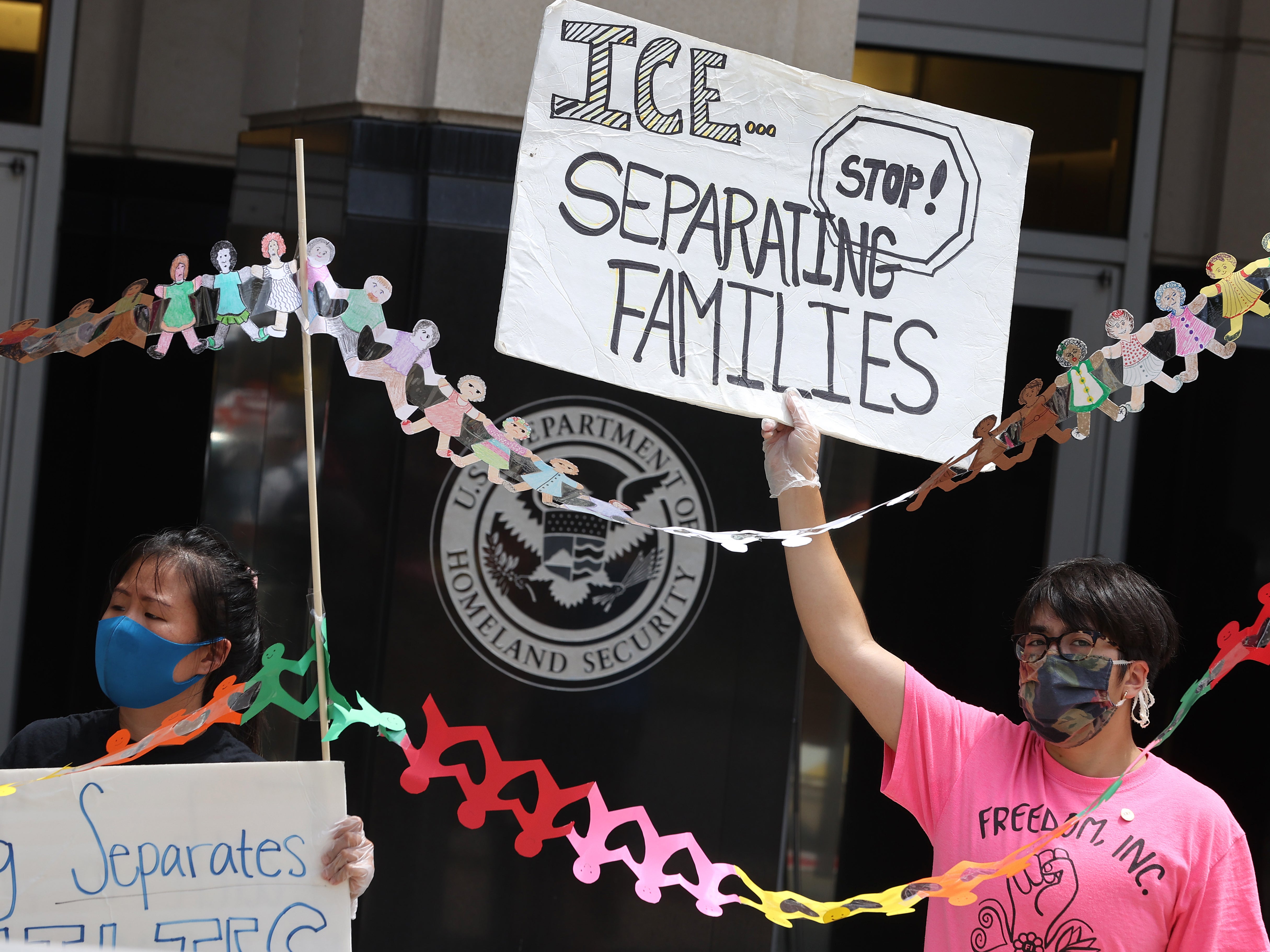 Protesters rally in front of the U.S. Immigration and Customs Enforcement headquarters, demanding the release of immigrants in ICE detention due to the dangers posed by the coronavirus pandemic July 17, 2020 in Washington, DC.&nbsp;