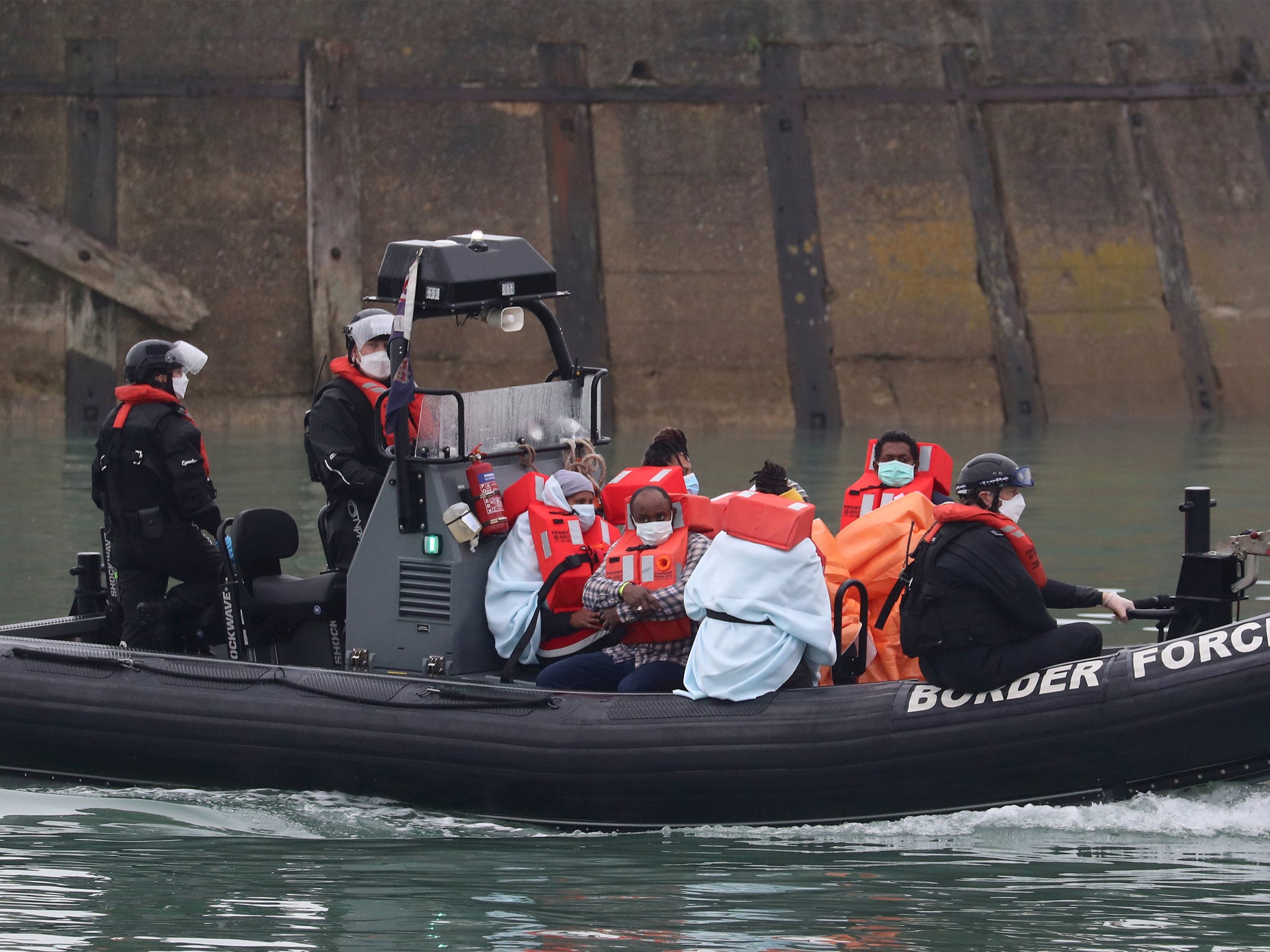 A group of people thought to be migrants are brought into Dover, Kent, by Border Force following a small boat incident in the Channel