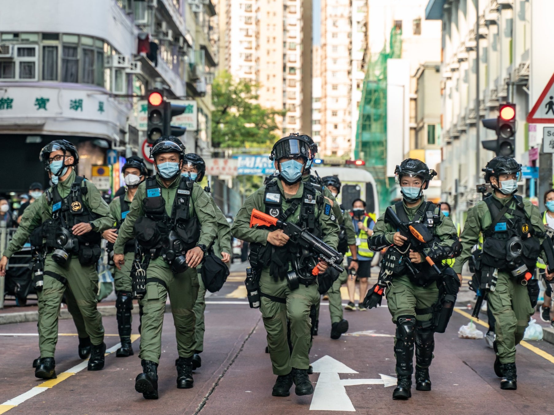 Riot police charge on a street during an anti-government protest in Hong Kong, Chin