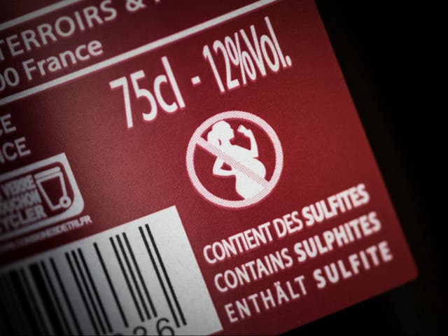 A French wine bottle with an icon picturing a forbidden sign on a pregnant woman drinking