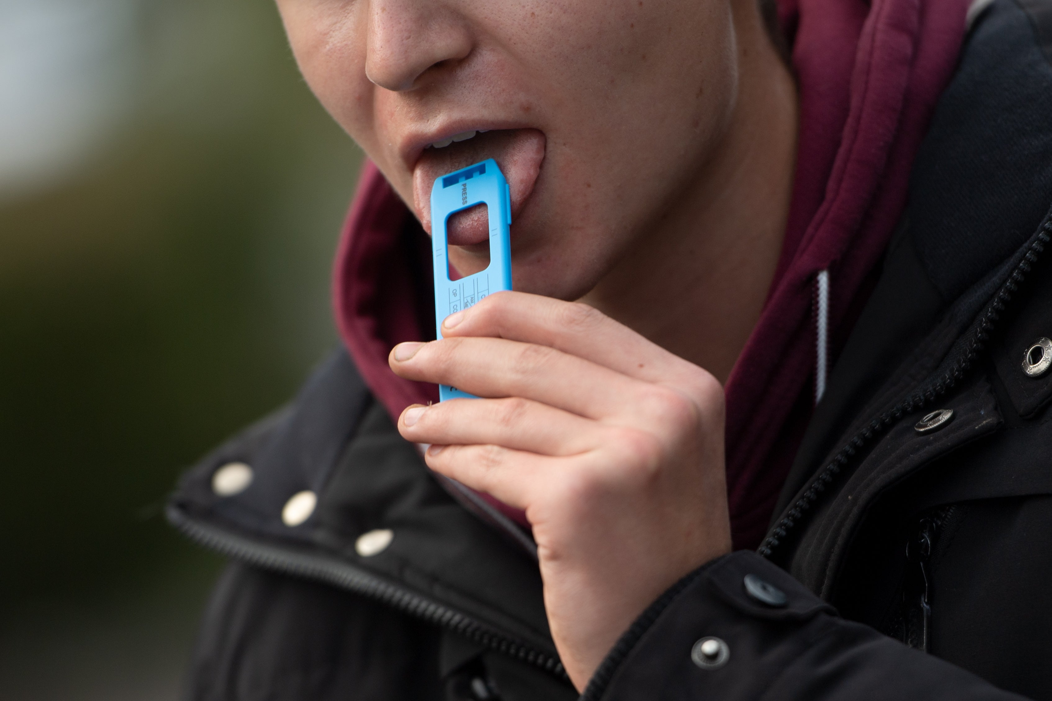 A man uses a saliva test in France during a police check on 29 September