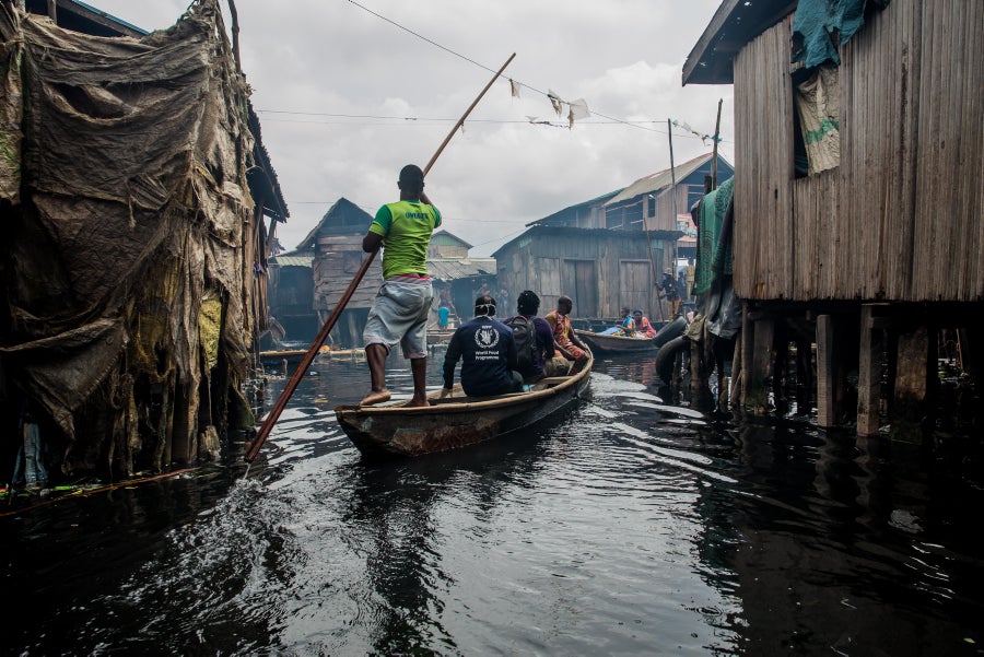 WFP staff travel by boat to the homes of beneficiaries of the National Home Grown School Feeding Programme in Makoko