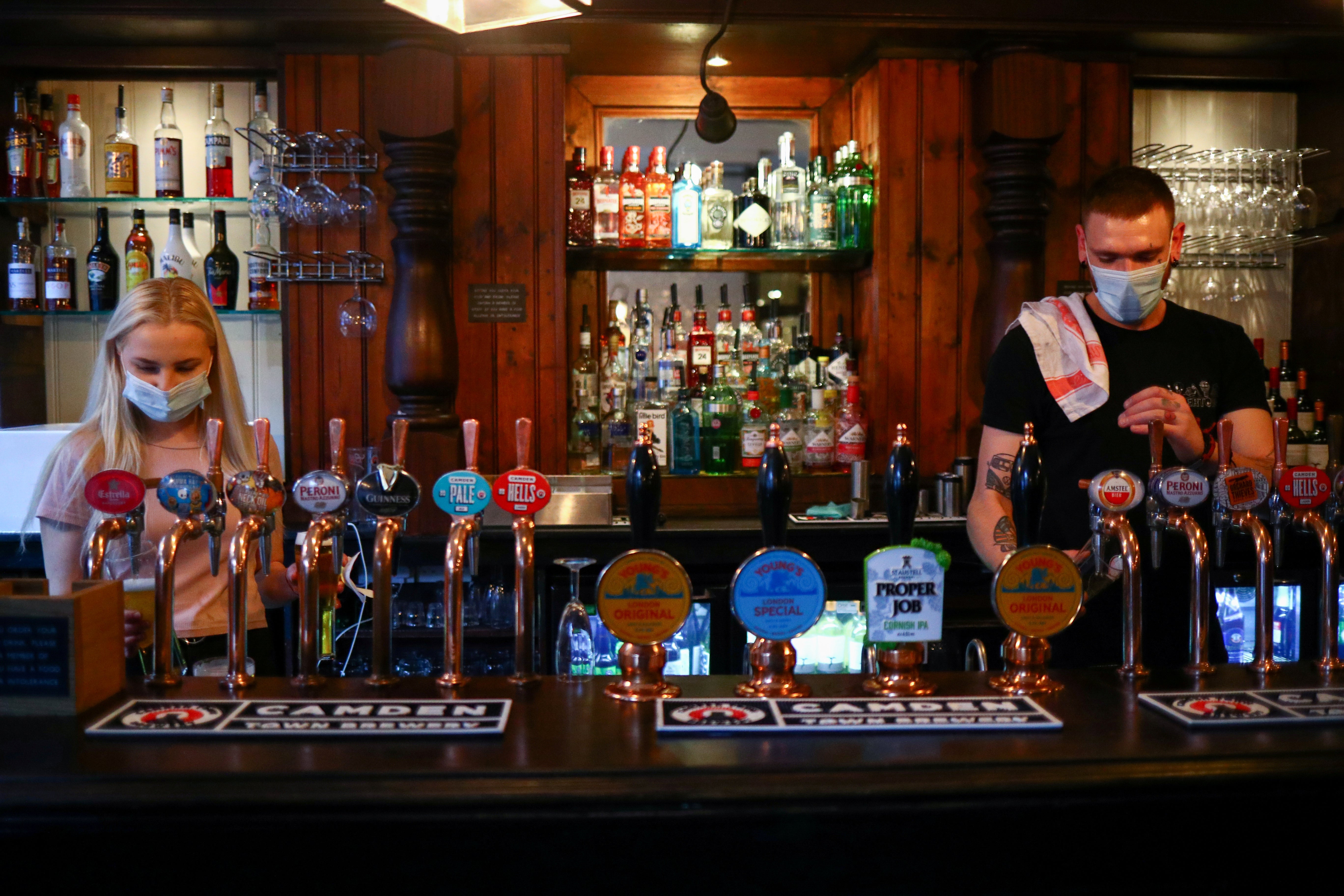 Staff pour drinks at a pub in London Bridge on 24 September, 2020, the day the 10pm curfew was introduced.