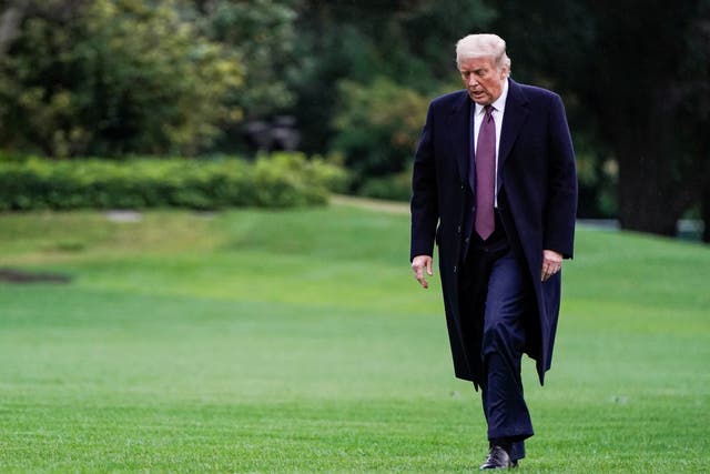 Donald Trump walks from Marine One as he returns from Bedminster, New Jersey