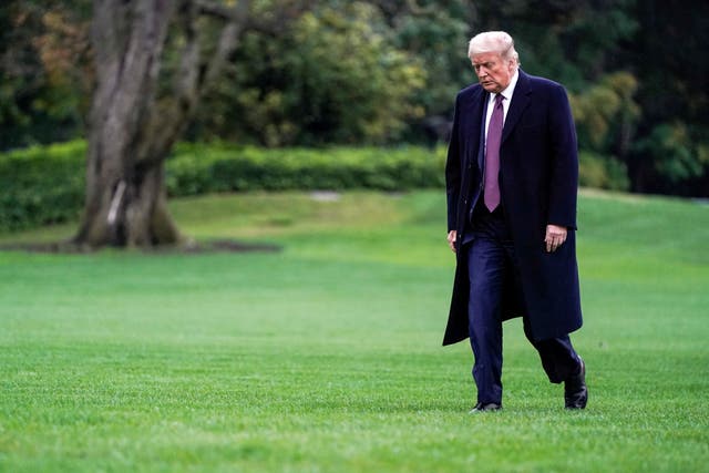 Donald Trump walks from Marine One as he returns from Bedminster, New Jersey on the South Lawn of the White House in Washington, 1 October