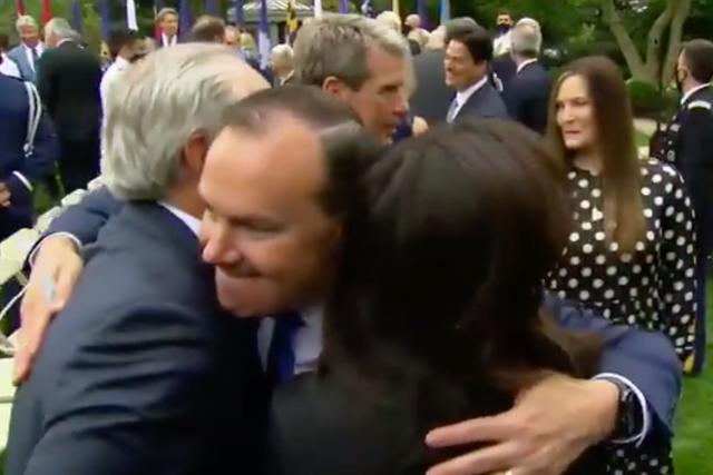 Senator Mike Lee of Utah, with no face covering, hugs fellow Rose Garden event attendees days before testing positive for Covid-19