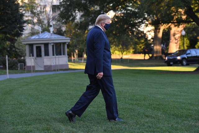 US President Donald Trump walks to Marine One prior to departure from the South Lawn of the White House in Washington, DC, October 2, 2020, as he heads to Walter Reed Military Medical Center, after testing positive for Covid-19. - President Donald Trump will spend the coming days in a military hospital just outside Washington to undergo treatment for the coronavirus, but will continue to work, the White House said Friday (Photo by SAUL LOEB / AFP) (Photo by SAUL LOEB/AFP via Getty Images)