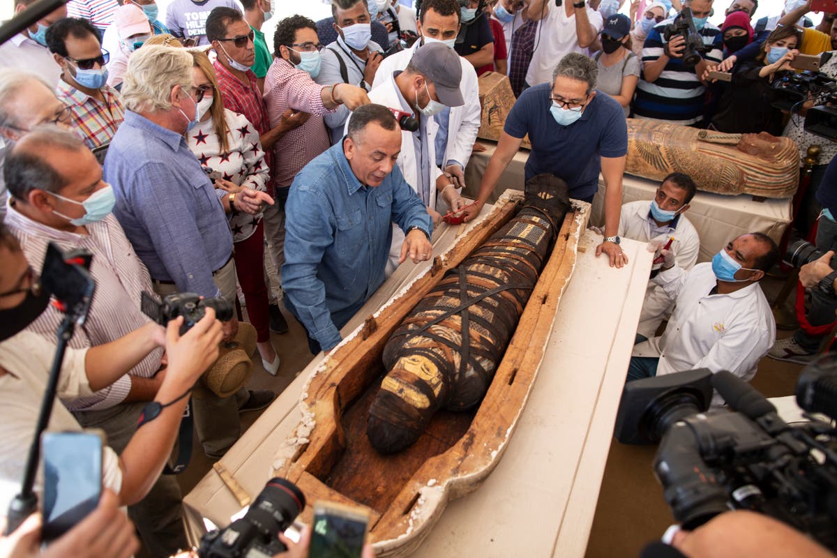 Egypt reveals 59 ancient coffins found near Saqqara pyramids