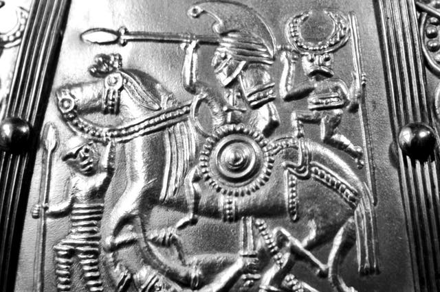 In battle, the Marlow warrior may have looked like this mounted sixth century war band leader (as portrayed on helmets found in England and southern Scandinavia). He is shown, armed with spear, sword and shield, trampling an enemy