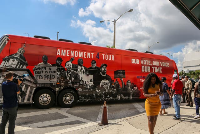 A tour bus, sponsored by the Florida Rights Restoration Coalition, pulls up to a Miami-Dade County courthouse to raise awareness of the movement