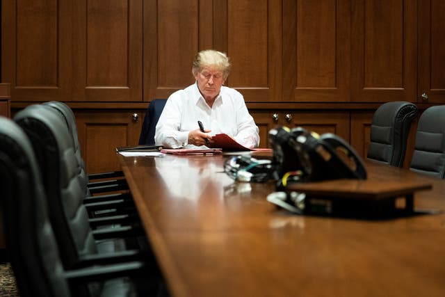 Trump works in his conference room at Walter Reed National Military Medical Centre after testing positive for Covid-19