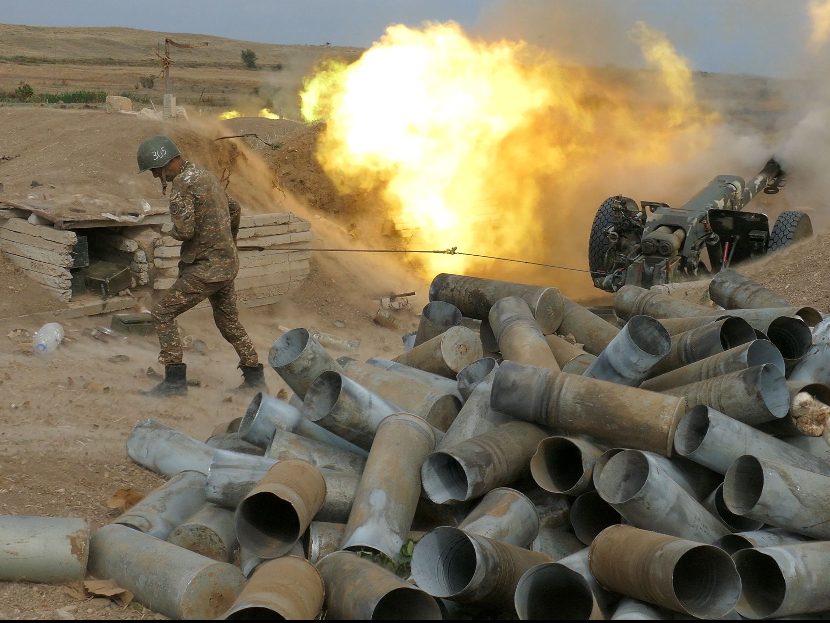 Karabakh's Defence Army fires an artillery piece towards Azeri positions on 4 October