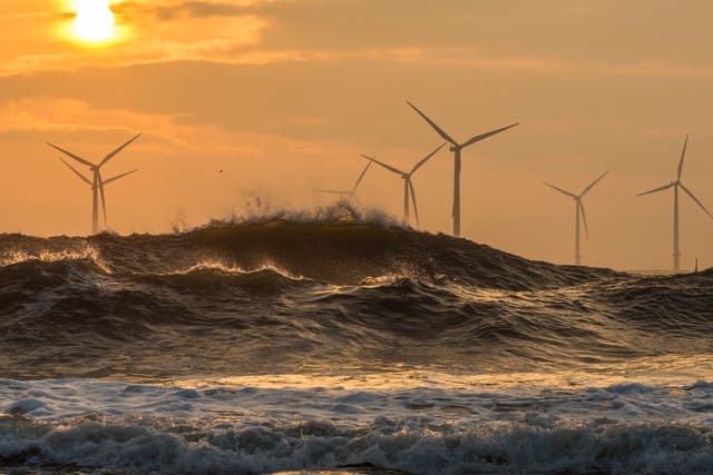 Wind turbines at sunrise off the northeast coast of England