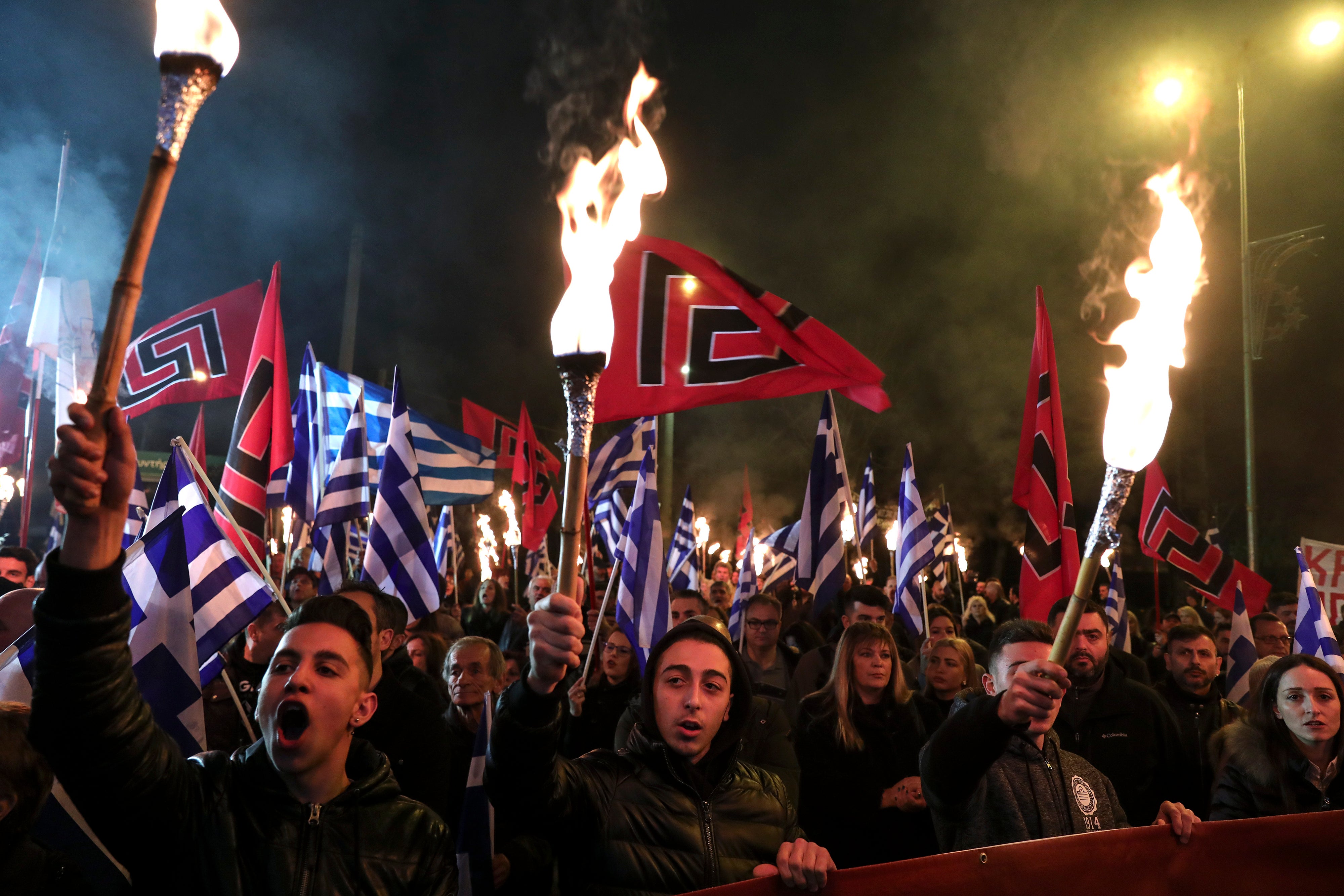 Supporters of far-right Golden Dawn take to the streets with torches
