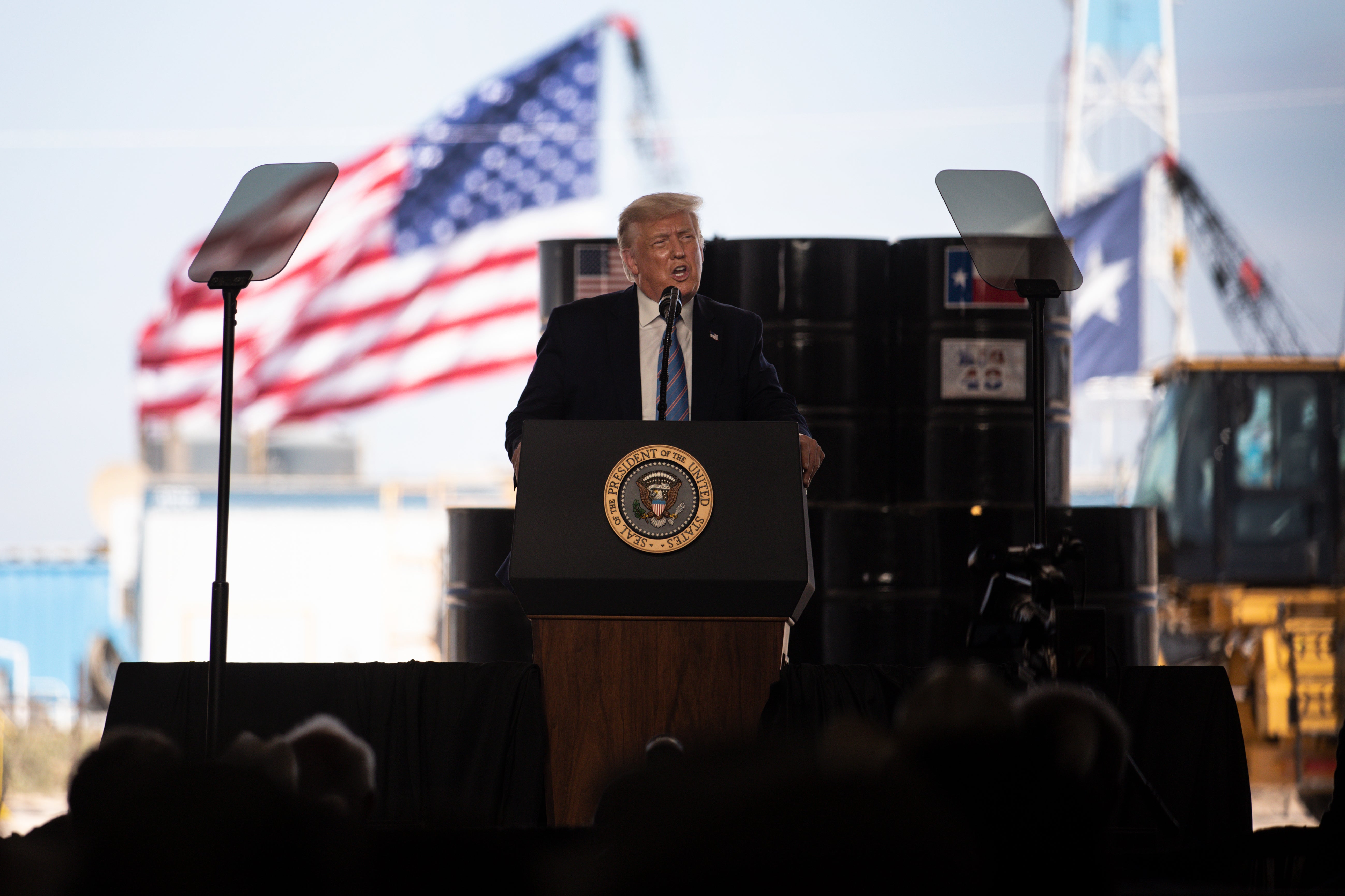 Trump speaks to city officials and employees of Double Eagle Energy on the site of an oil rig in Midland, Texas