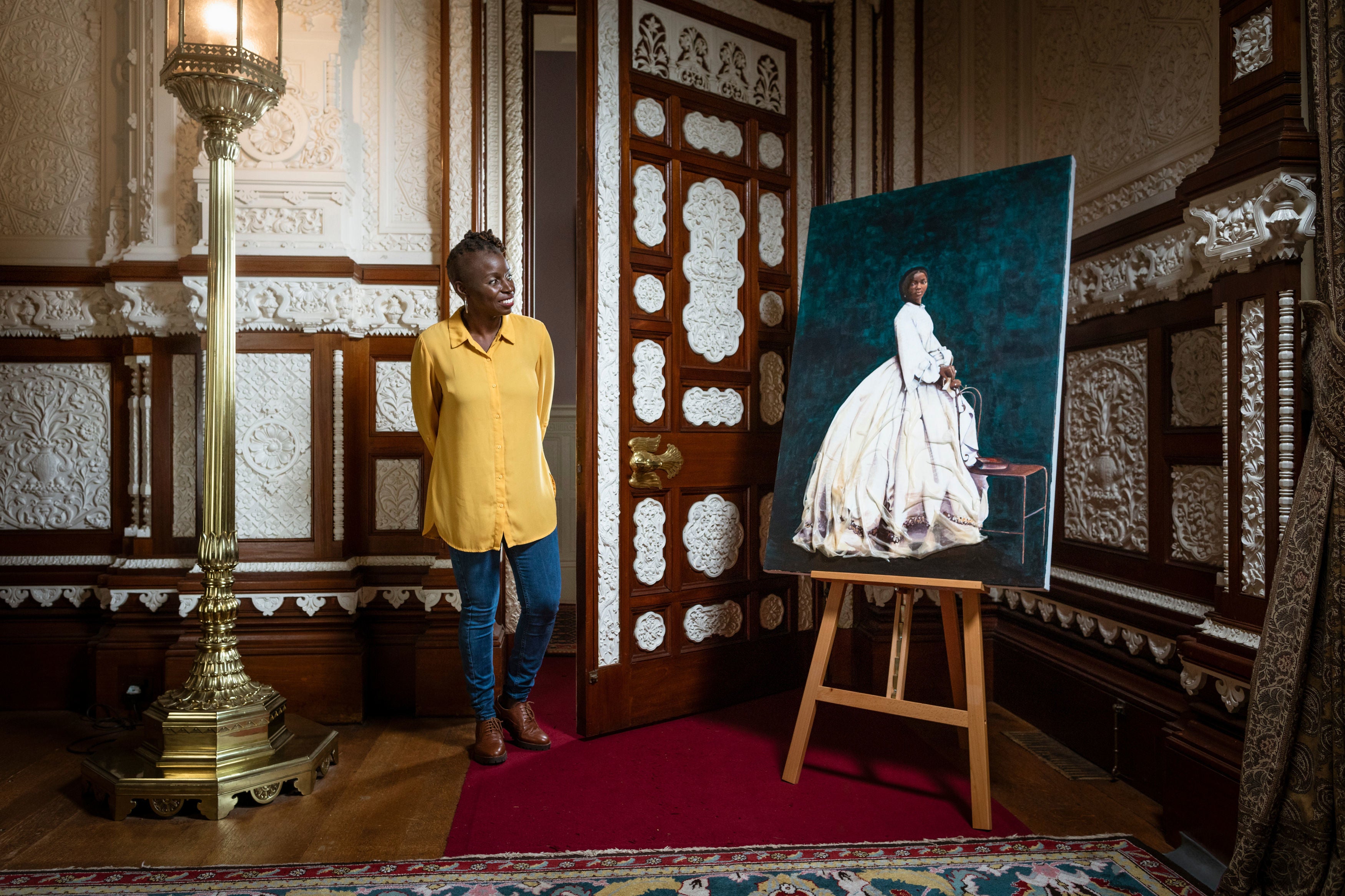 Artist Hannah Uzor with her painting of Sarah Forbes Bonetta, Queen Victoria’s African goddaughter