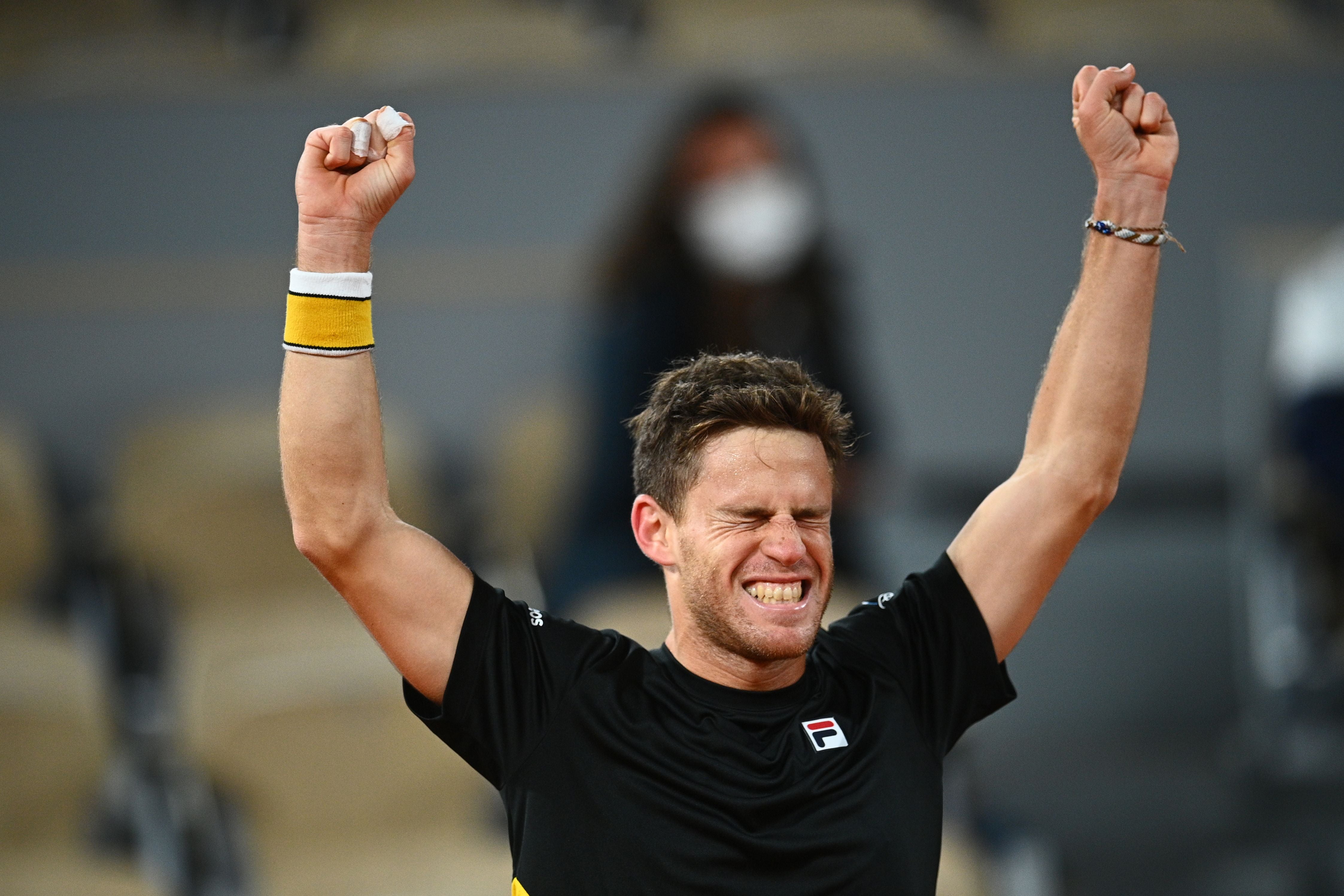 Diego Schwartzman celebrates his epic victory over Dominic Thiem at the French Open