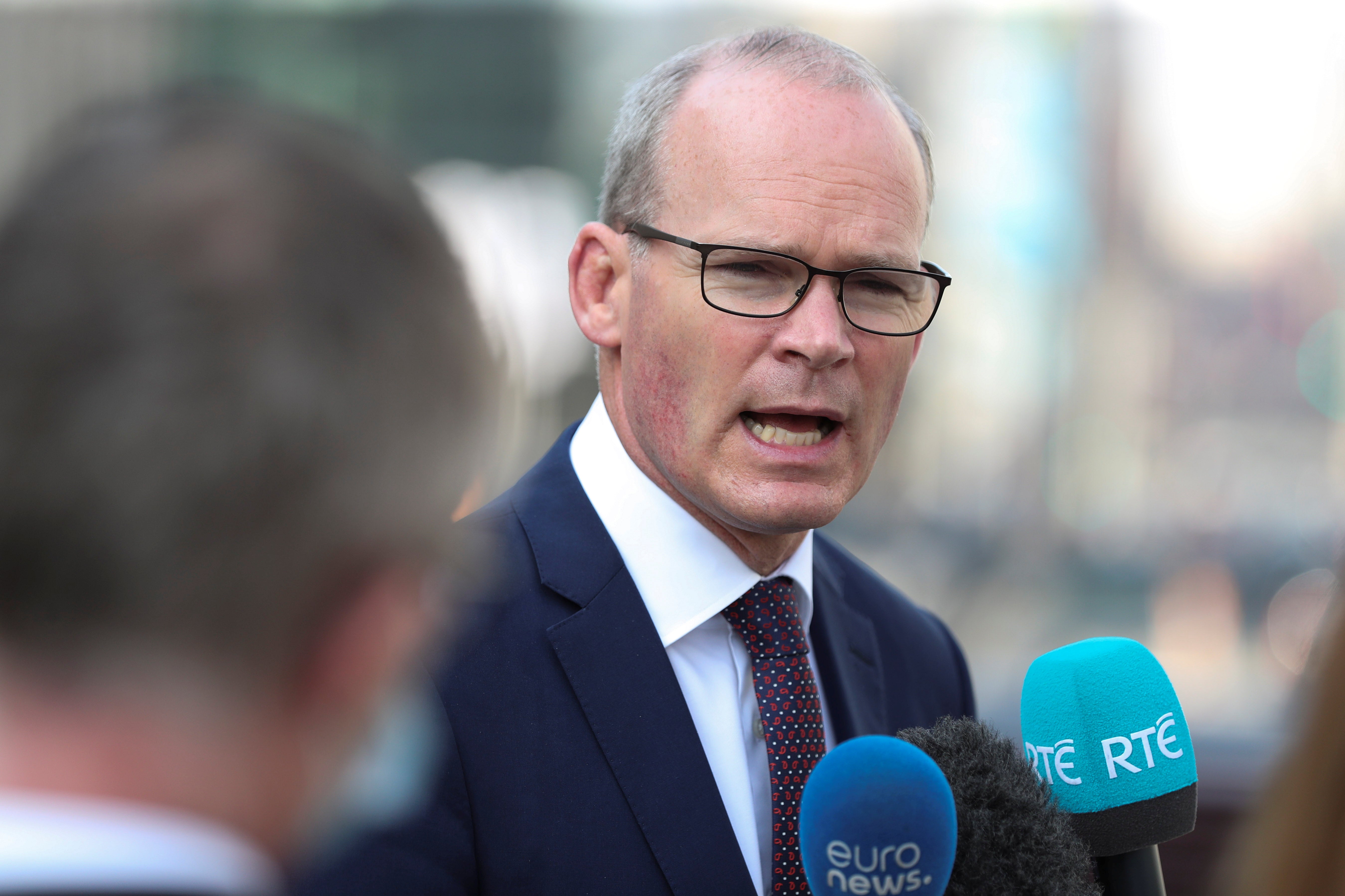 Simon Coveney speaks to the media in Brussels