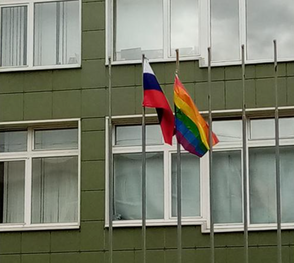 Rainbow flag flies next to a Russian flag at a St Petersburg school
