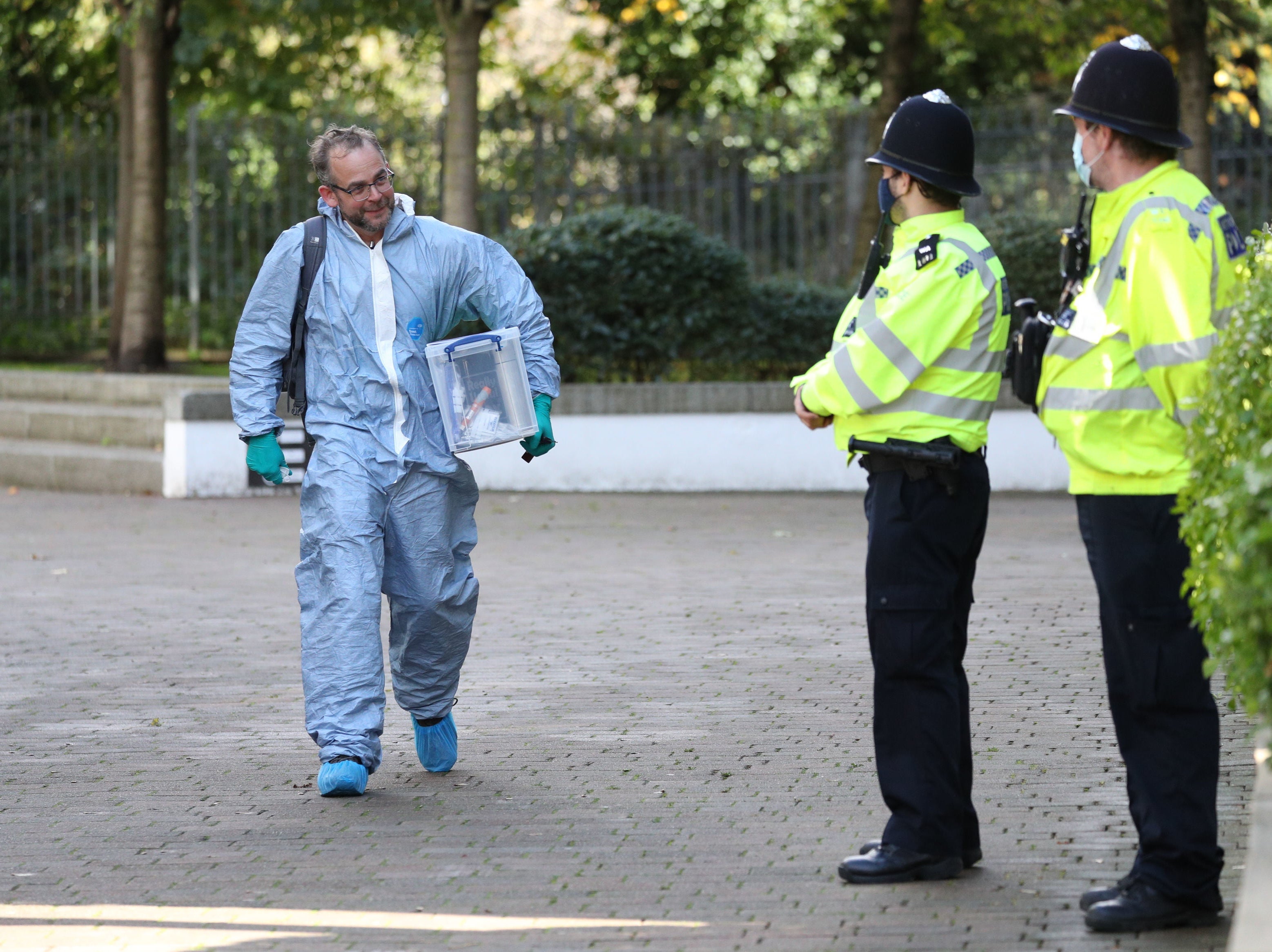 A forensics officer outside Golden Mile House in Clayponds Lane, Brentford, west London.