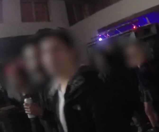 A still from a Met Police officer’s body camera shows people gathered at an illegal rave in east London over the weekend.