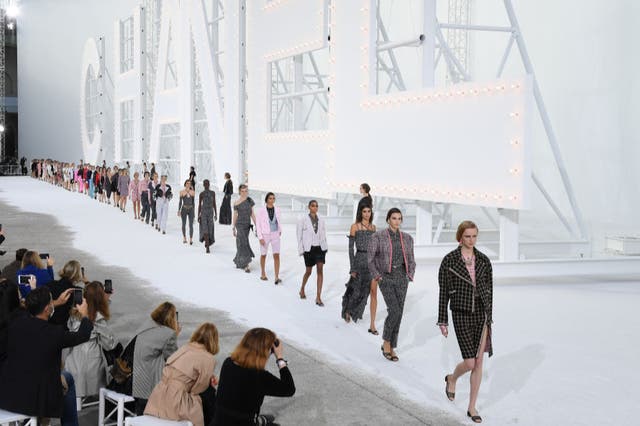 Models walk the runway during the Chanel Womenswear spring/summer 2021 show as part of Paris Fashion Week on 6 October