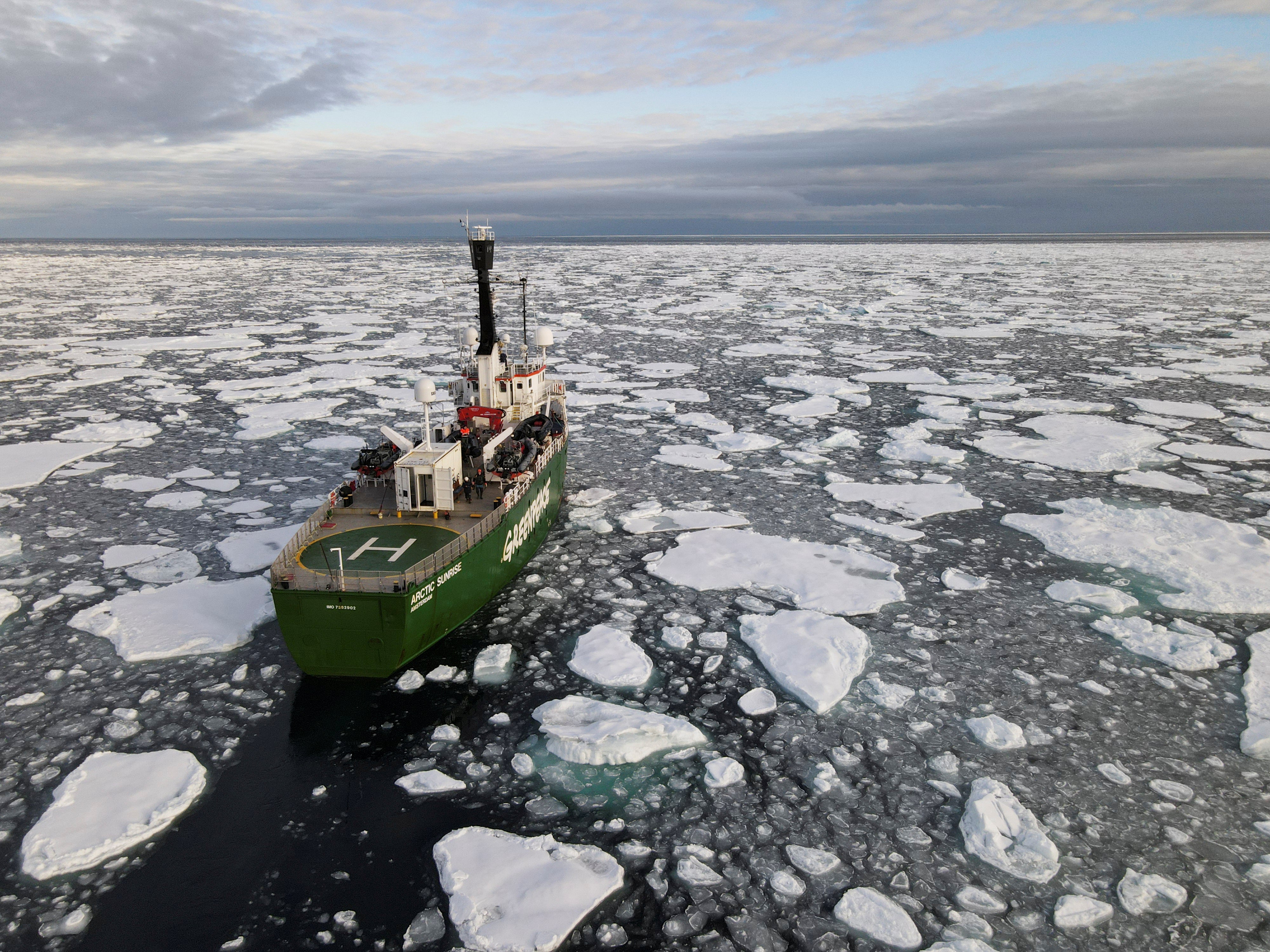 Ship navigates through melting ice in the Arctic