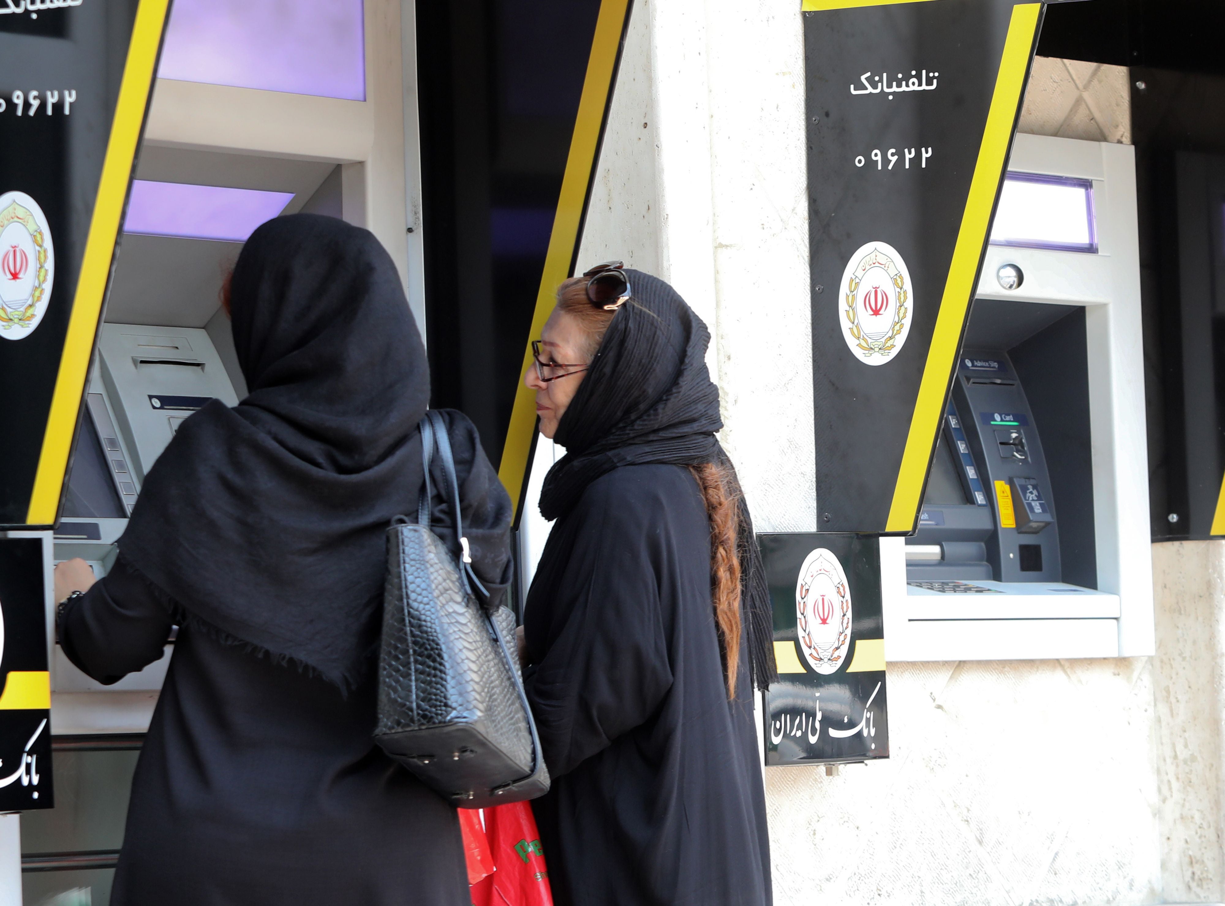 Iranian women use ATM machines in Tehran. US president Donald Trump’s administration has imposed sweeping sanctions on Iran’s banking sector, taking a major new step aimed at crippling its arch-rival’s economy weeks ahead of US elections