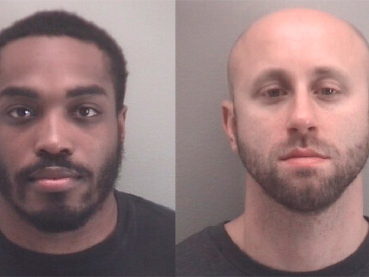 Booking photo provided by Richmond Police shows from left Richmond Police Officers Christopher Brown and Mark Janowski