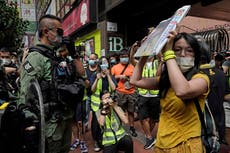 Hong Kong police arrest 9 for aiding dozen to flee territory