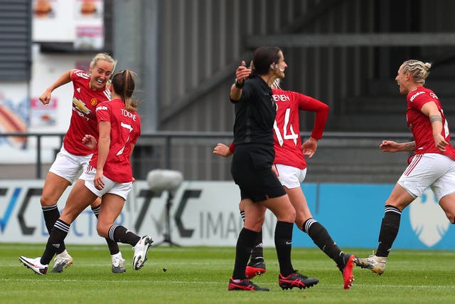 Manchester United Women players celebrate Millie Turner’s match-winning goal
