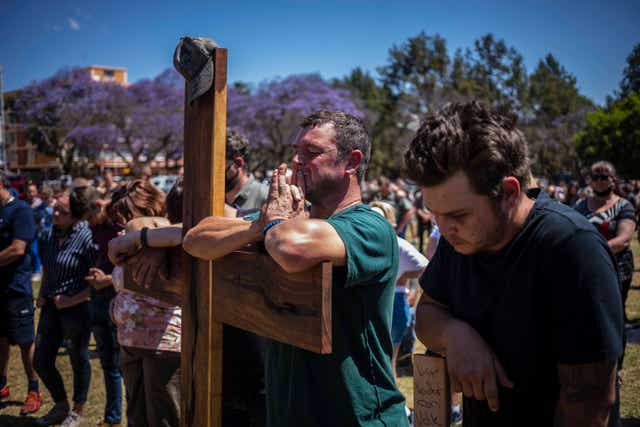 Farmers pray during a march to the Union Buildings calling for action to be taken against the high number of farmers murdered in Pretoria, South Africa. 