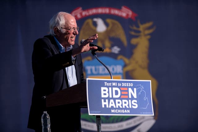 Sen. Bernie Sanders speaks to the crowd at a car rally campaign event for Democratic presidential candidate former Vice President Joe Biden on Monday, Oct. 5, 2020, in Warren, Mich. (Nicole Hester/Ann Arbor News via AP)