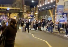 Impromptu cricket game on London street draws crowd after 10pm curfew