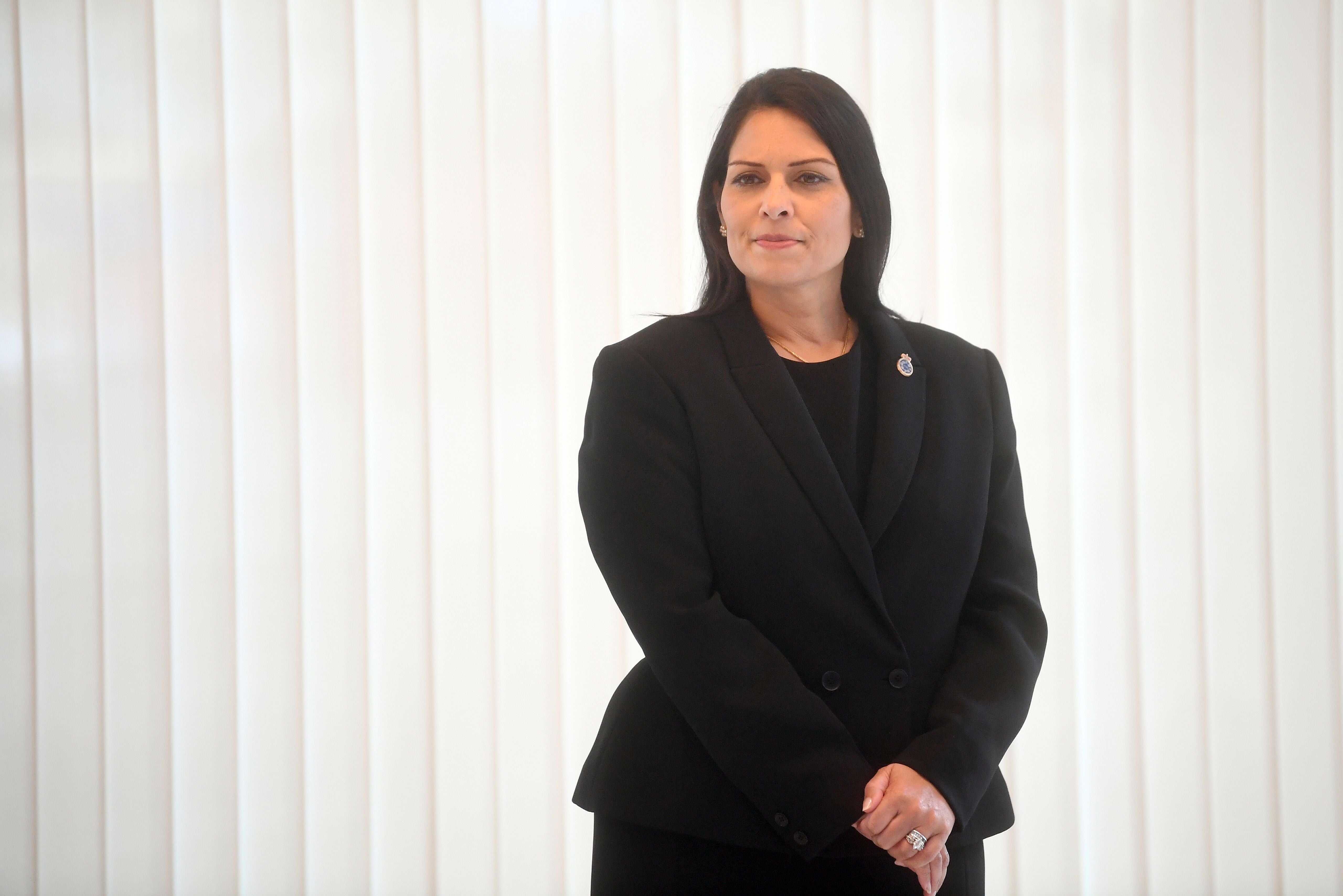 Priti Patel looks on ahead of a minute’s silence inside the atrium at Scotland Yard in London on 25 September 2020