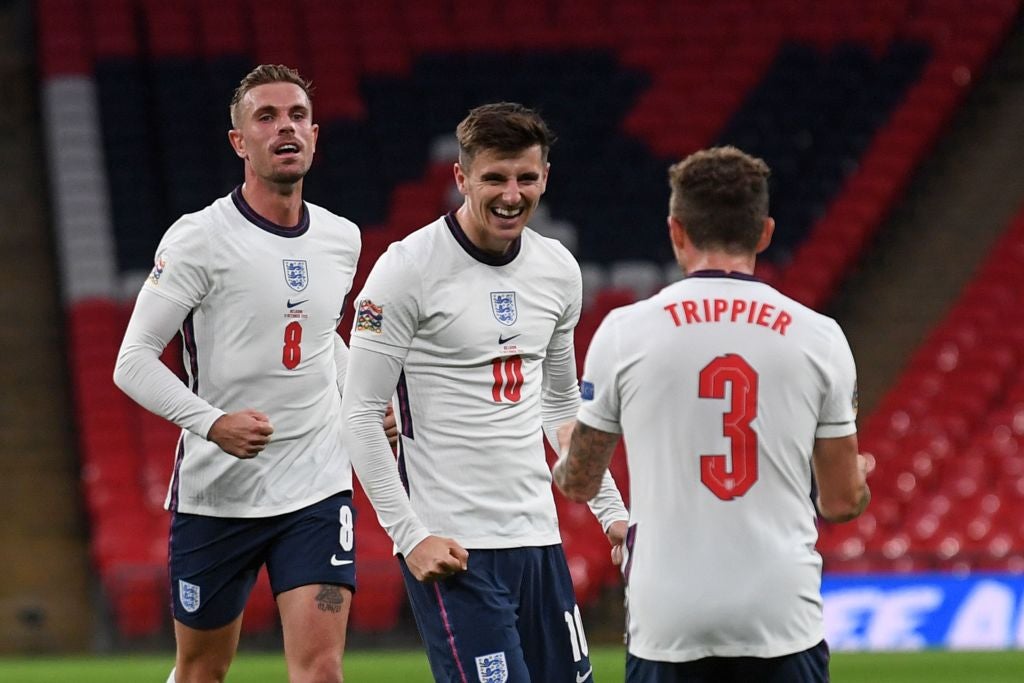 Jordan Henderson and Kieran Trippier congratulate Mason Mount