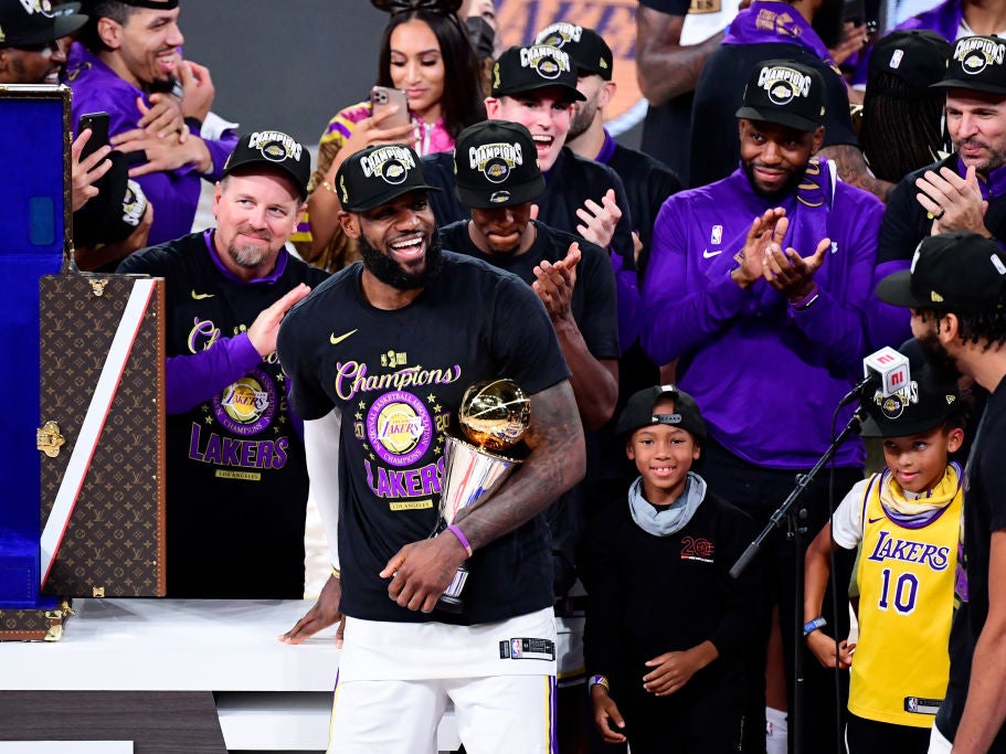 Lebron James celebrates with the MVP trophy