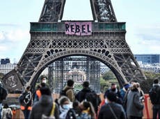 Extinction Rebellion protesters scale Eiffel Tower to unfurl banner