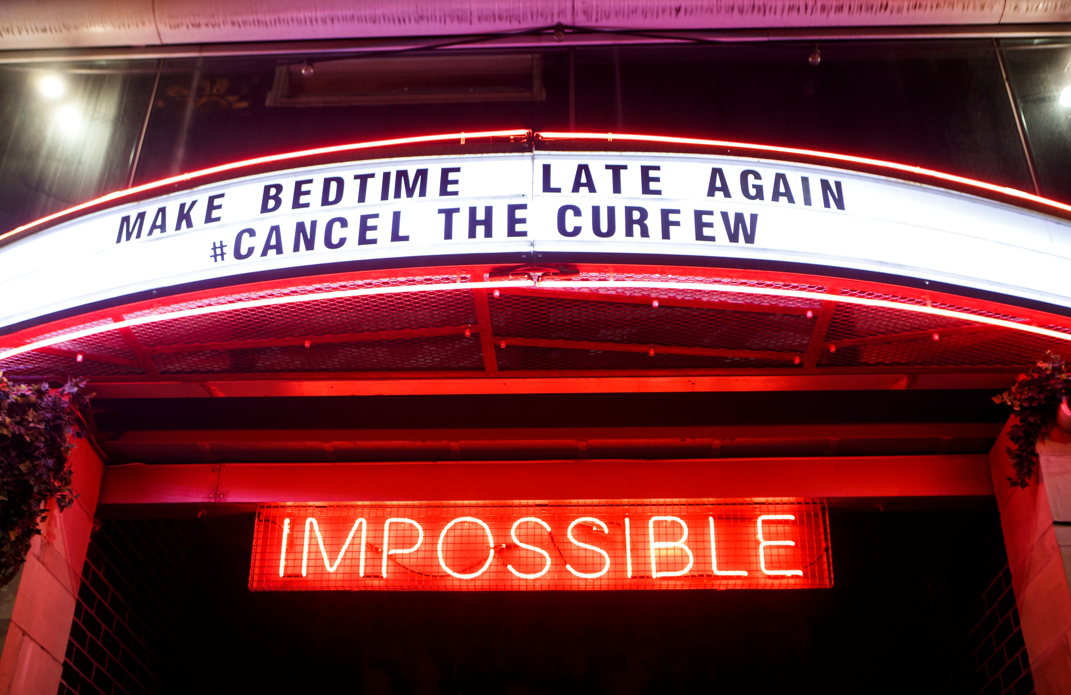 A bar sign in Manchester calling for the cancellation of curfews on venues