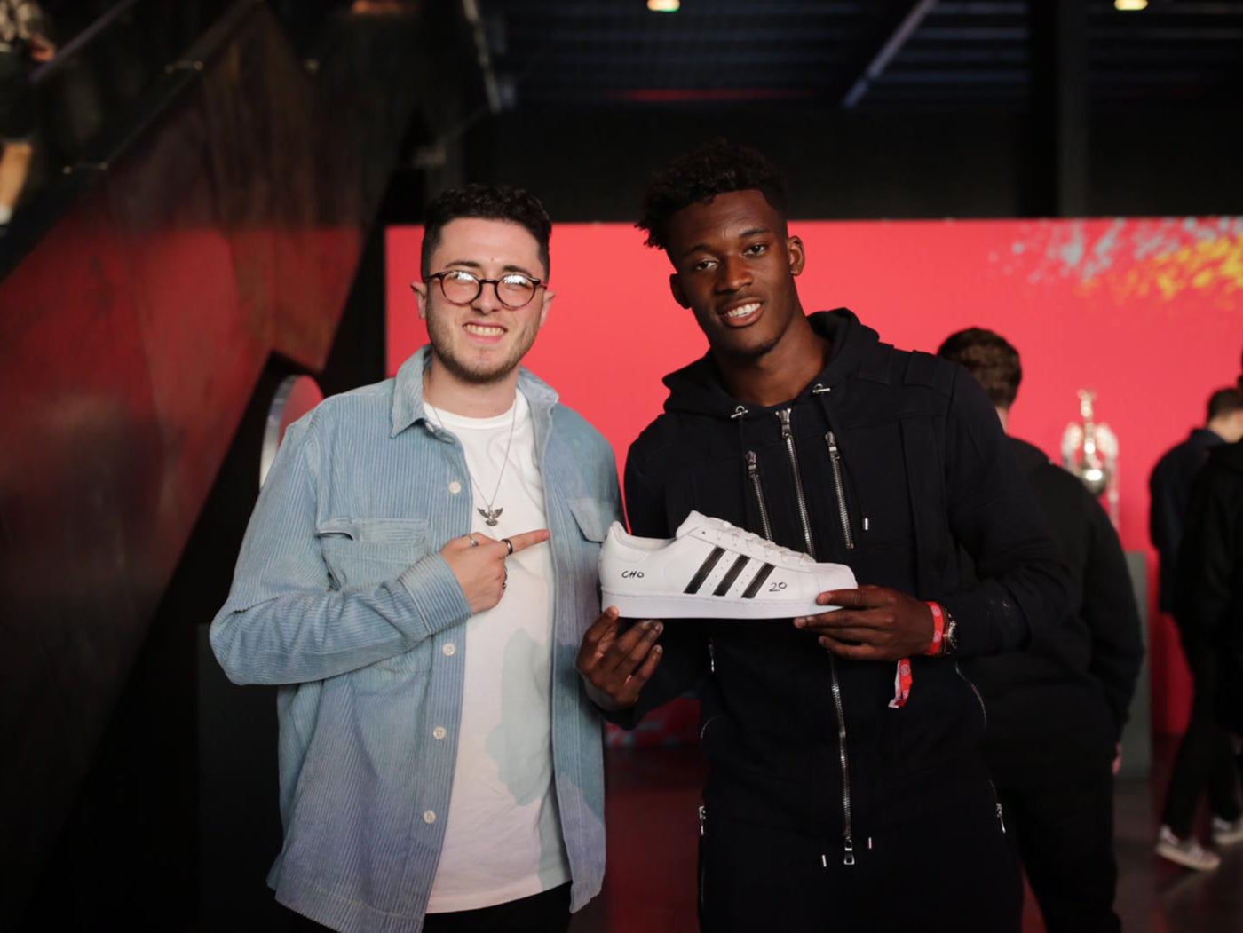 Jordan Dawson presents Callum Hudson-Odoi with a custom Adidas shoe