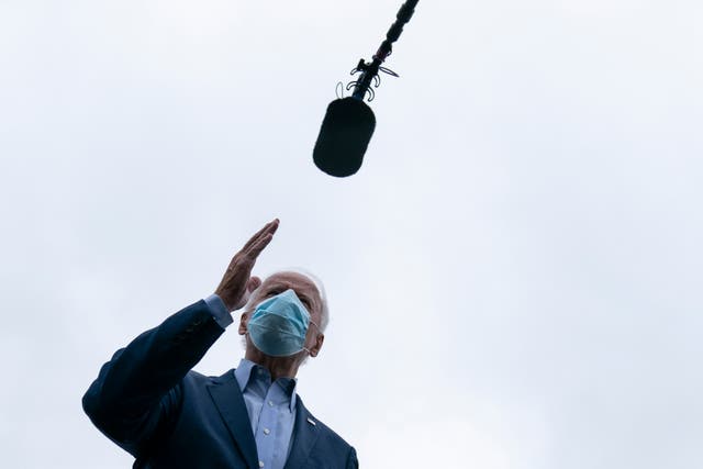 Joe Biden. A mask. And a mic,.