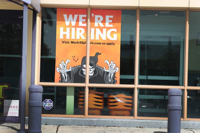 A “We’re Hiring” sign is seen in a store front window on 4 September 2020 in Miami, Florida