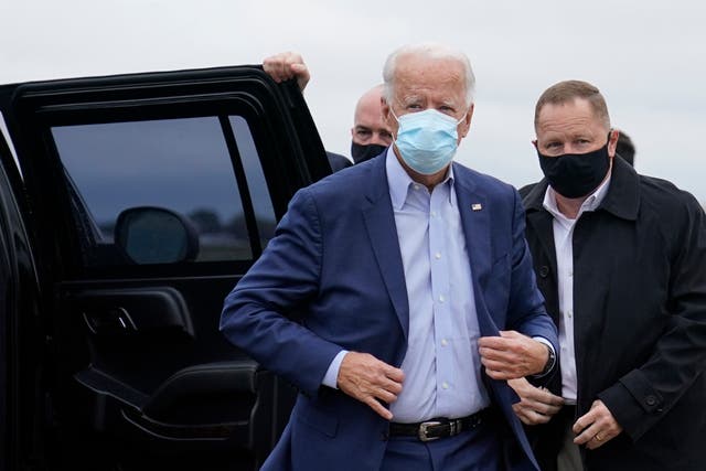 Democratic presidential candidate former Vice President Joe Biden exits his motorcade to board his campaign plane at New Castle Airport